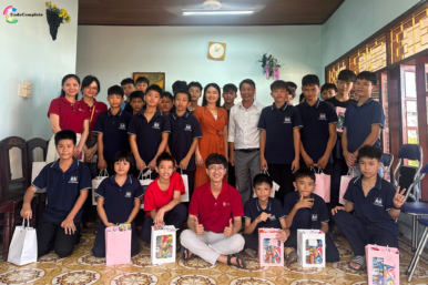 CodeComplete team and SOS Village children sharing smiles, gifts, and meaningful moments of care together.